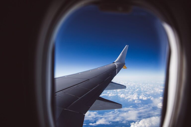 Aerial view from an airplane window approaching Venice — transfer from Paris to Venice on a High Point Holidays trip.