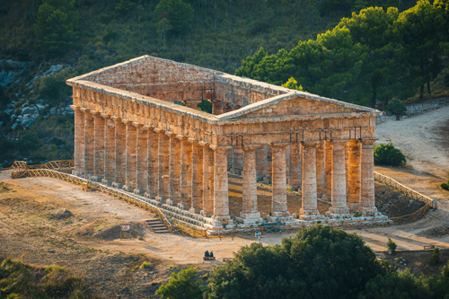 Ancient Greek Temple of Segesta in Sicily surrounded by rolling Mediterranean hills